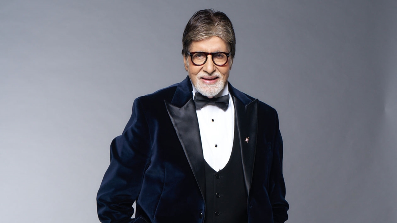 Amitabh Bachchan greeting fans outside his residence during a public appearance.